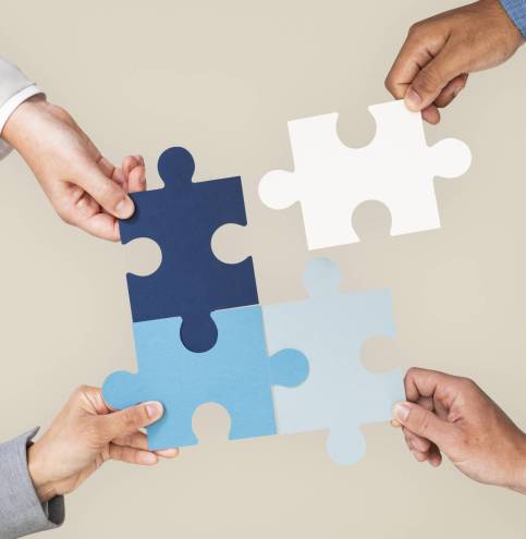 Hands holding puzzle business problem solving concept